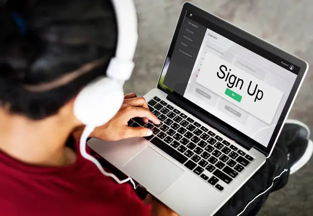 A person filling out a form on a website to sign up for a free trial.